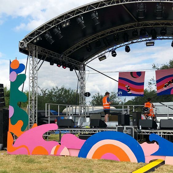 A stage set up with a colourful display around the front