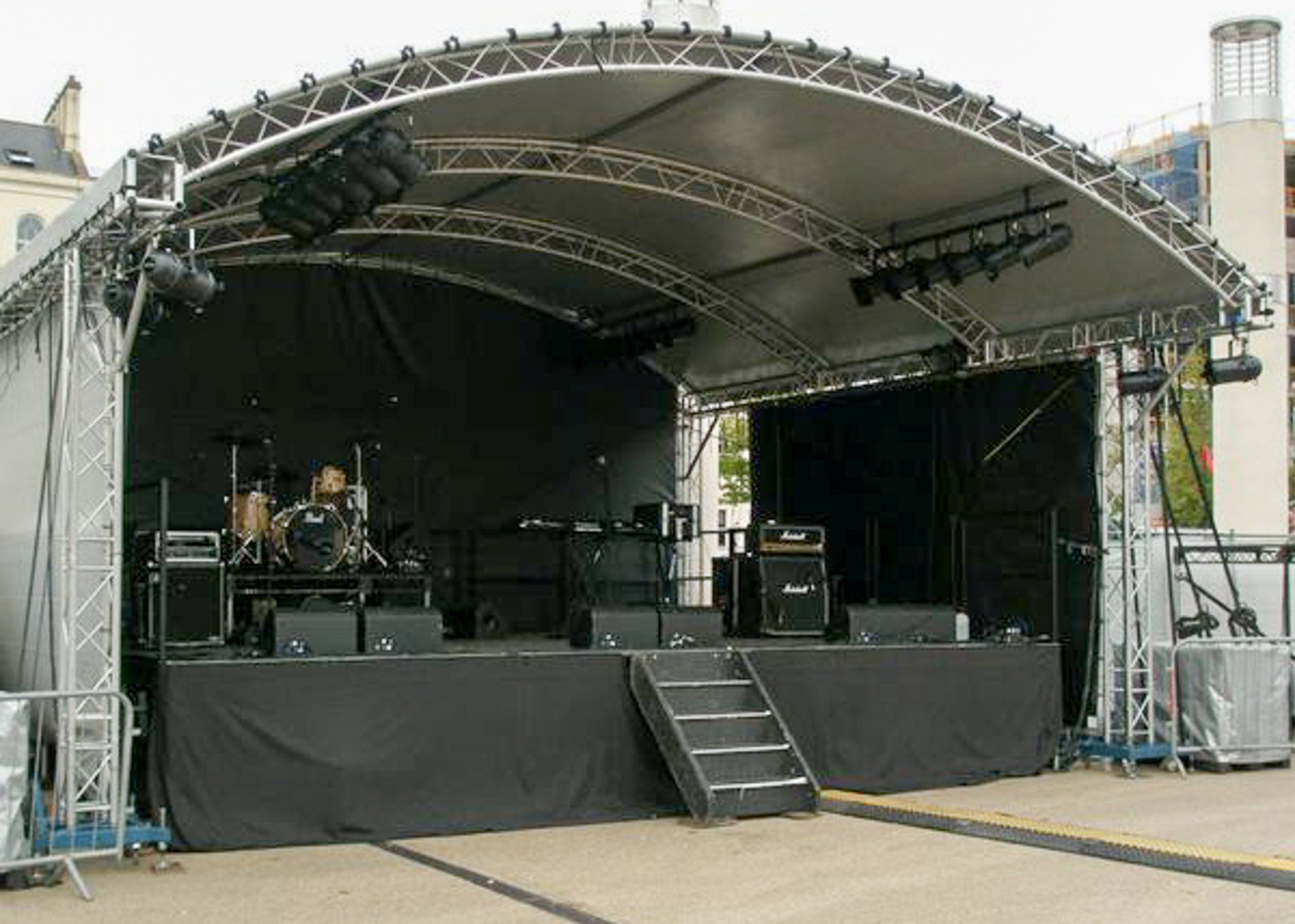 X-Large Arc Truss stage set up for an event on contract hire with steps at the front