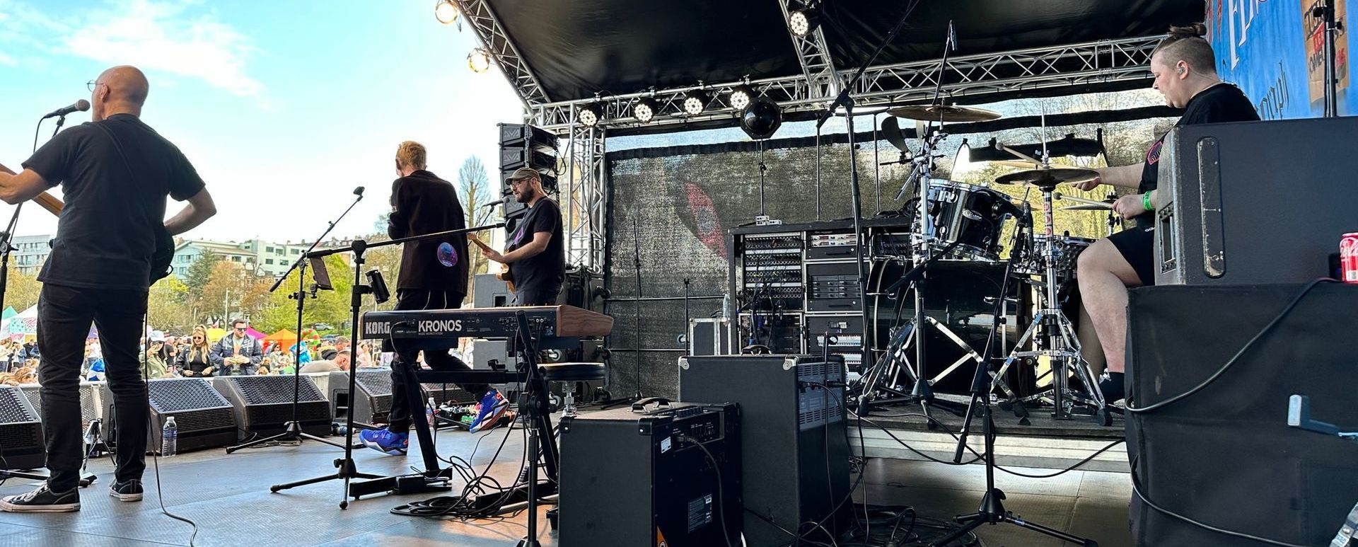 A shot from inside an arc truss stage whilst a band performers