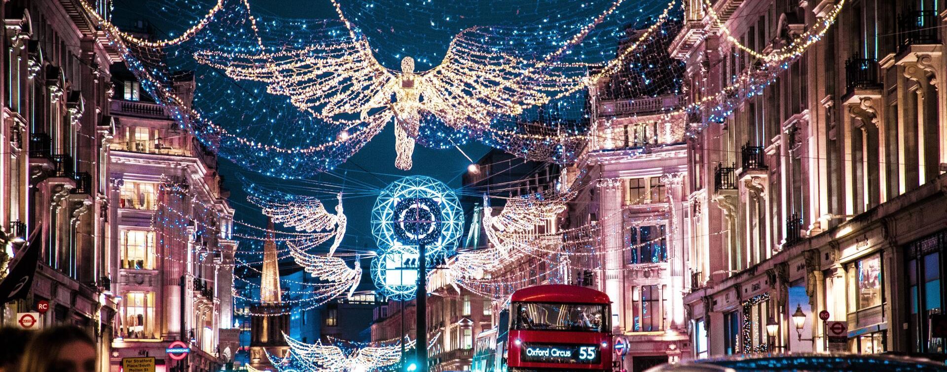 Christmas lights over a busy road, angels and snow globes
