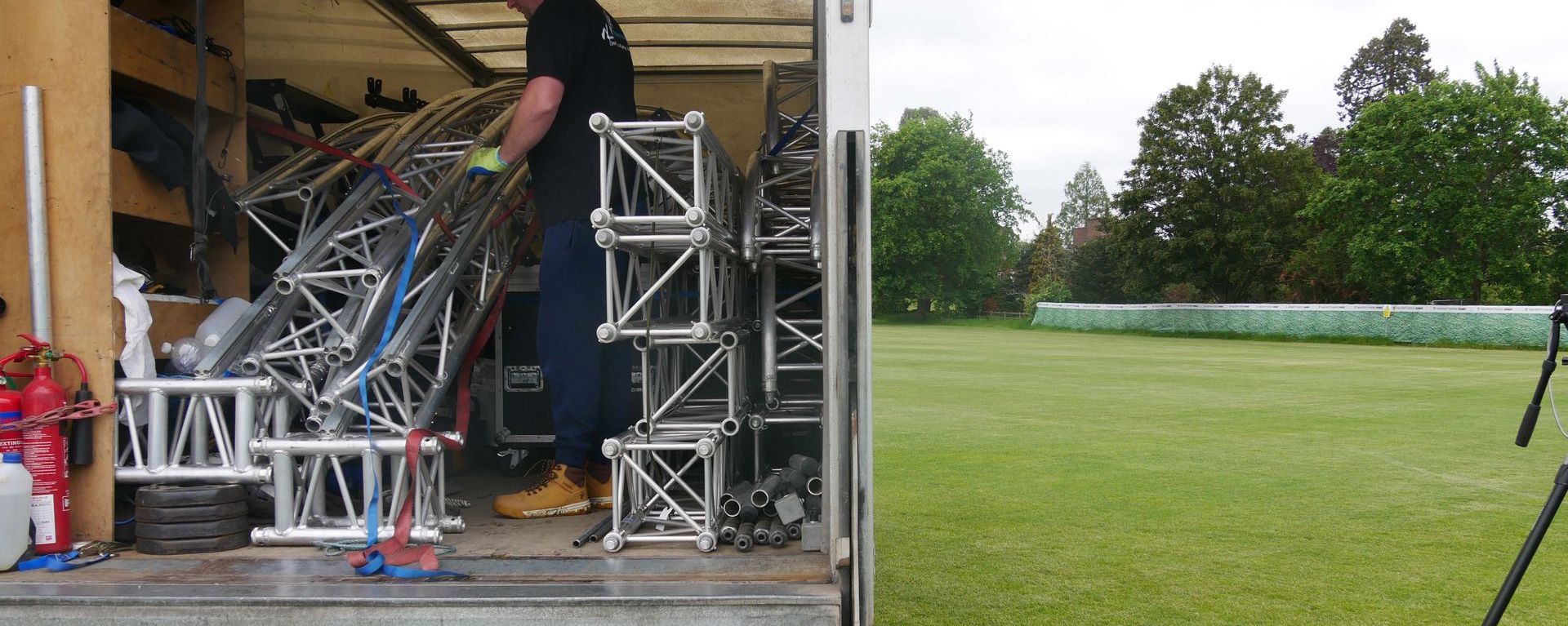 A truck full of kit on a green event site