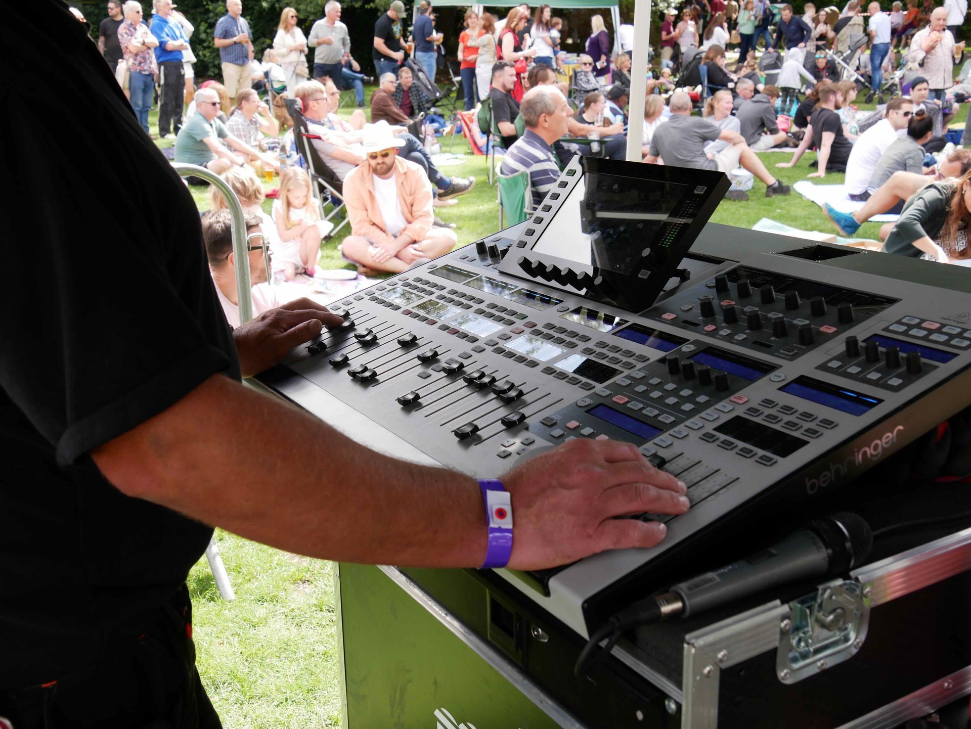 Close up of a man working a sound desk