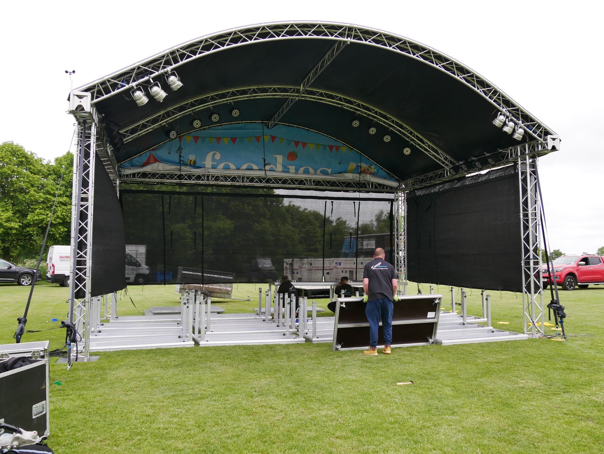 Arc truss stage with decking upside down on the floor