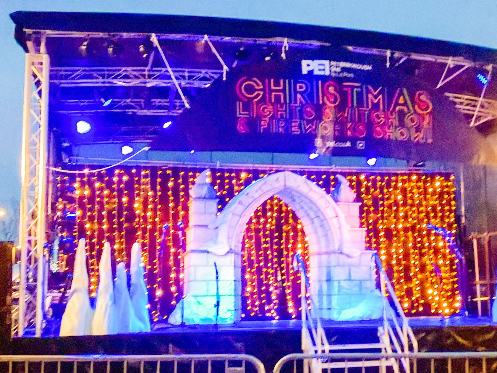 Trailer stage at a light switch on event with festive snow decorations on stage
