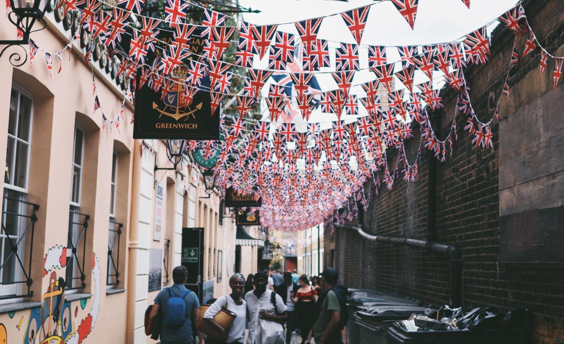 a traditional British street with Union Jack bunting