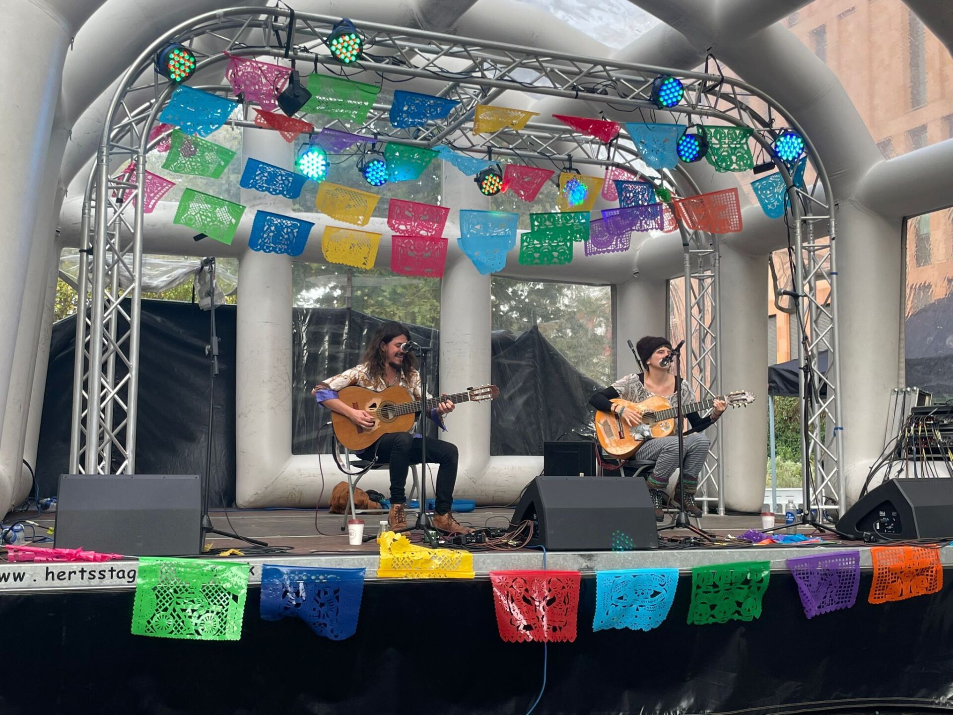 Two singers on an inflatable roofed stage