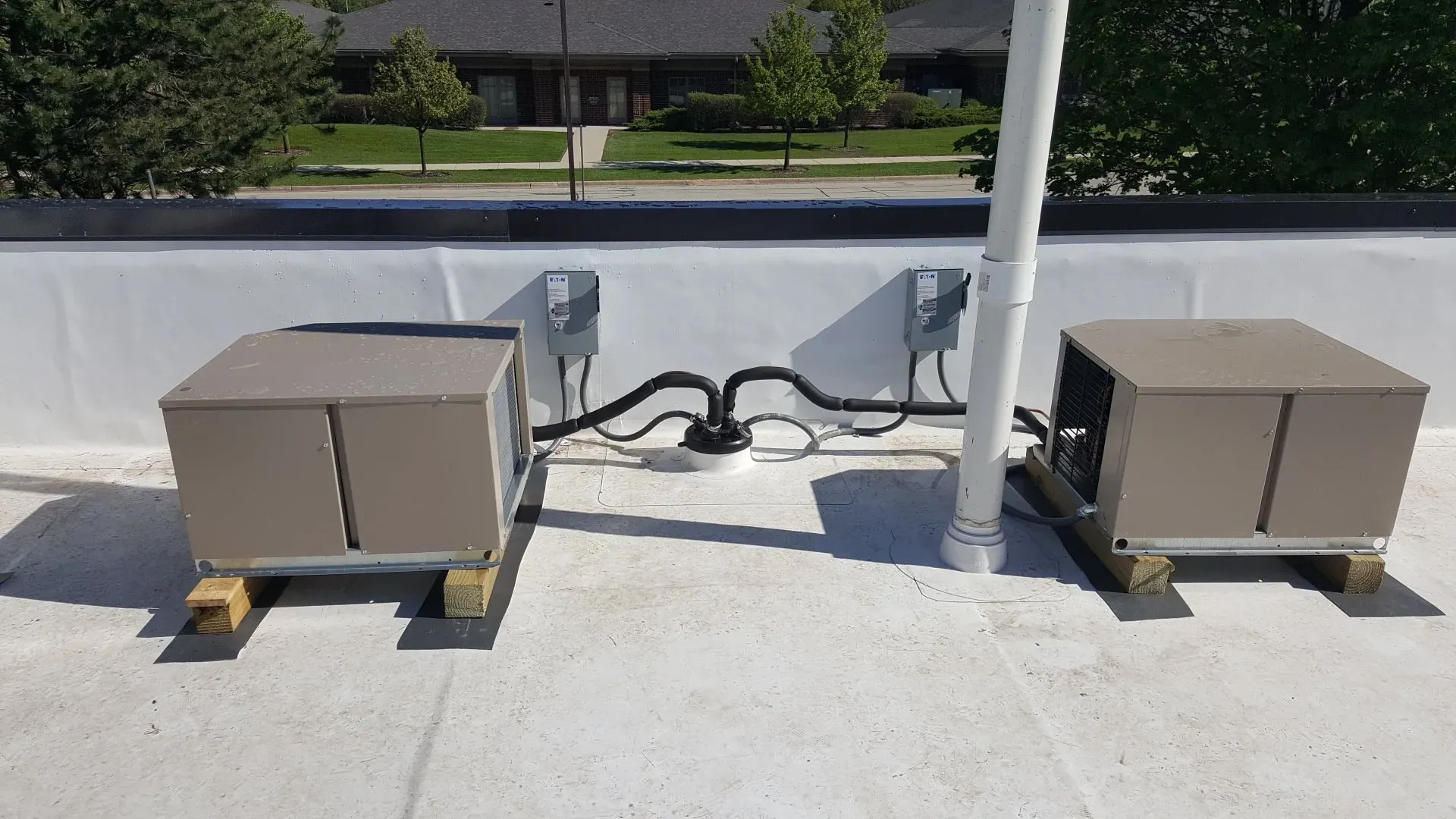 Two metal box like structures on roof — Lombard, IL — Cordial Electric Inc.