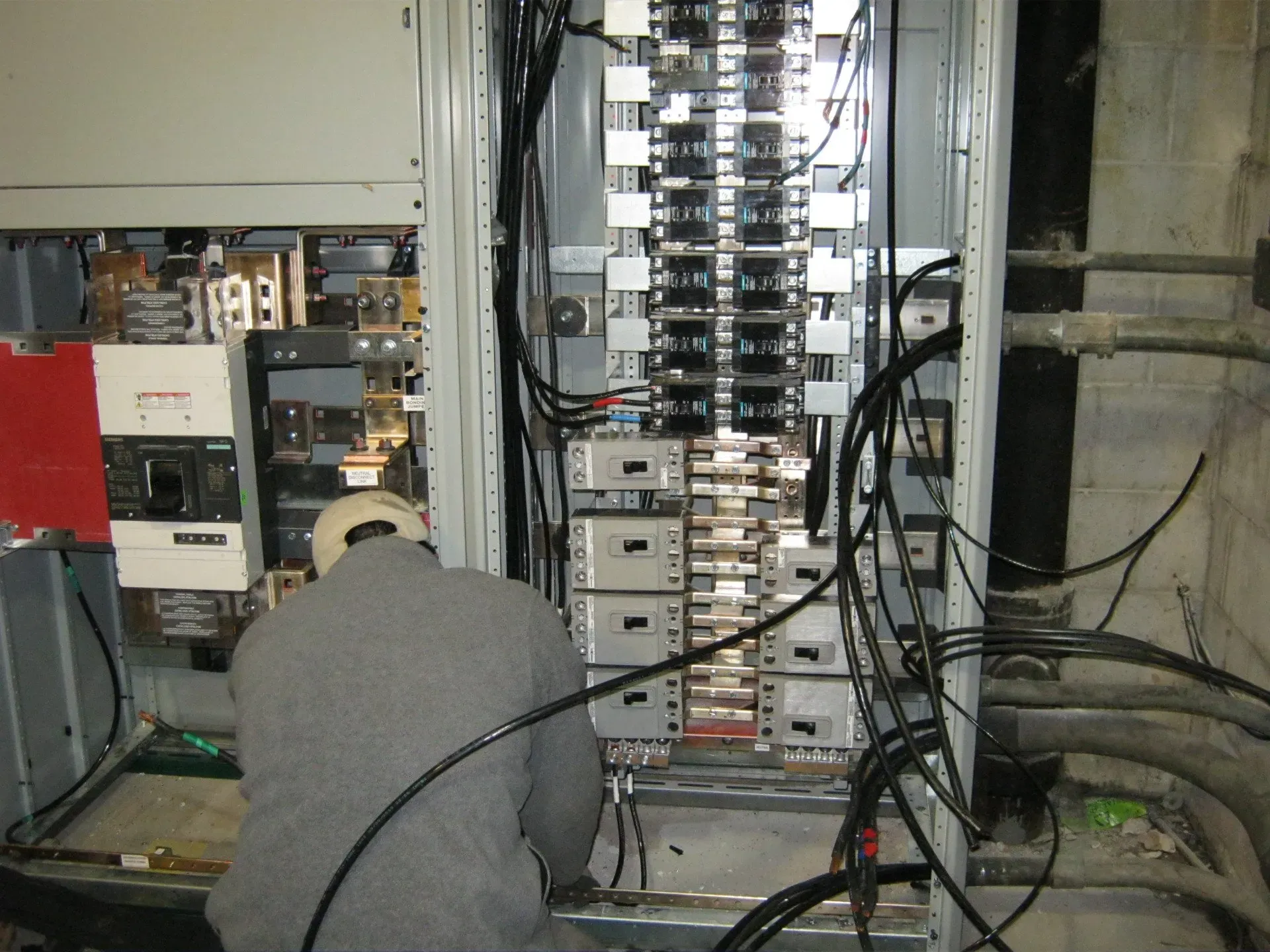 Man working on breaker and circuits — Lombard, IL — Cordial Electric Inc.