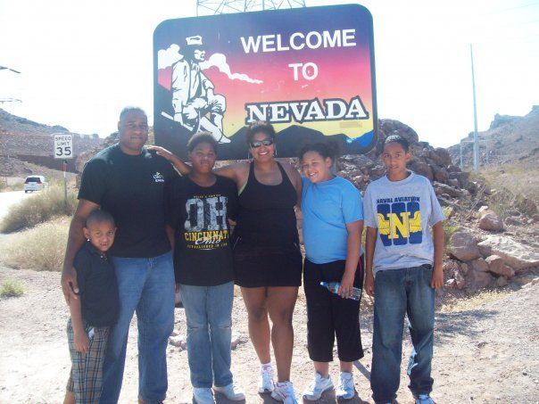Family poses in front of a