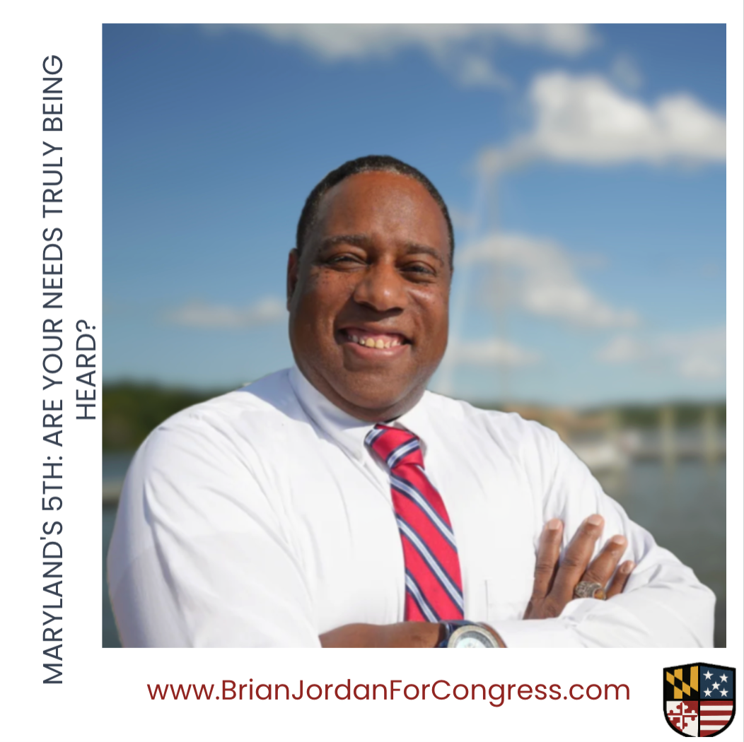 Brian Jordan , running for congress in 5th District MD, smiling, arms crossed, outside, with campaign text and logo.