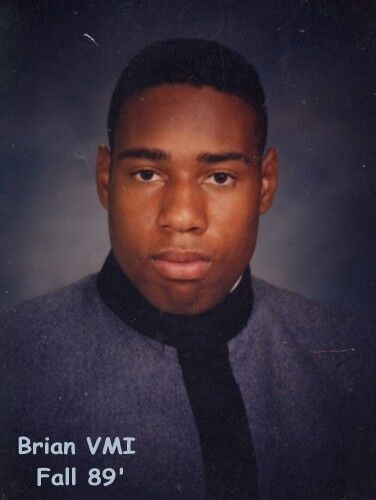Portrait of Brian, a Black man, in a formal uniform from VMI. The photo was taken in the fall of 1989.