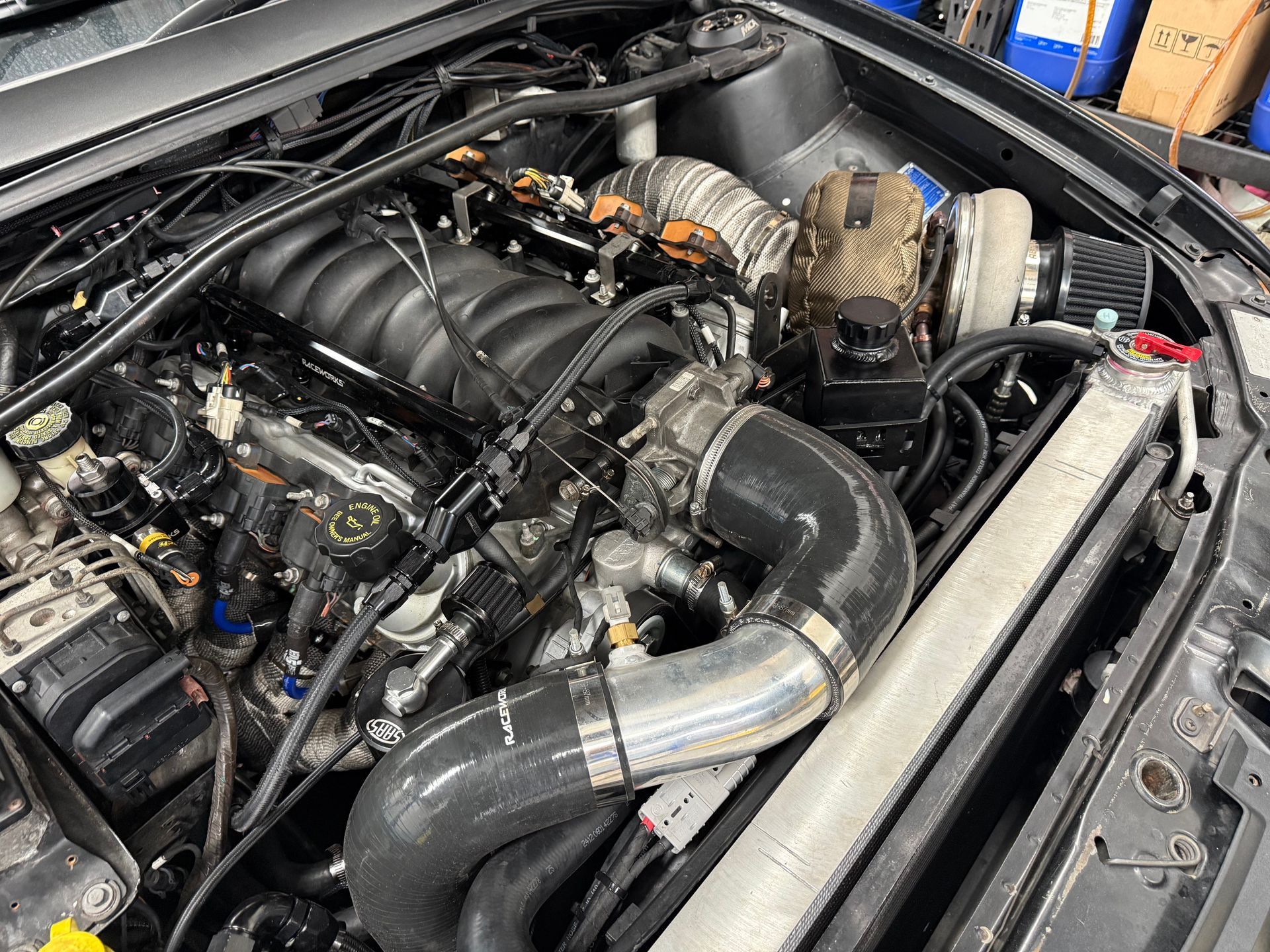 A High-angle View of a Turbocharged V8 Engine Inside a Vehicle's Engine Bay — Mad Monkeys Mechanical in Cairns City, QLD