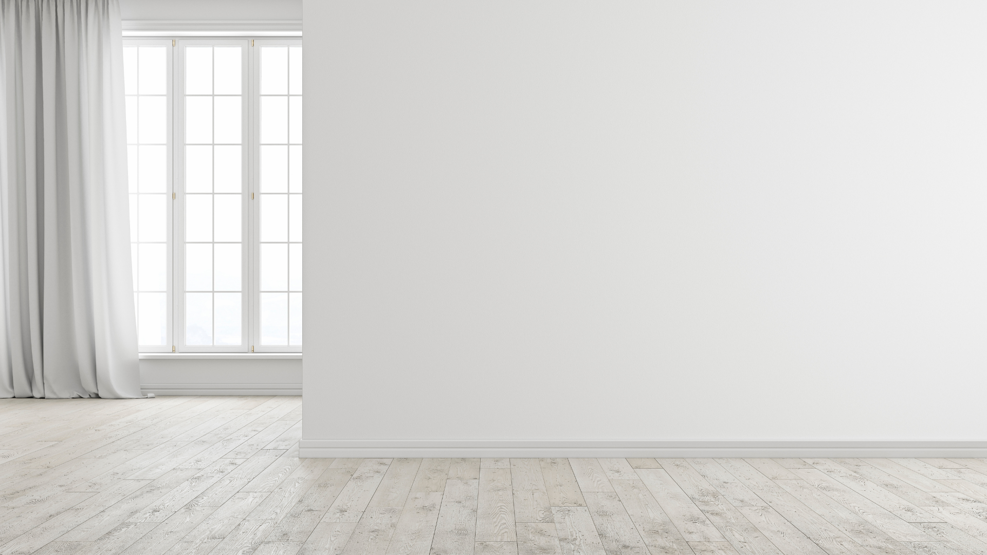 Empty room with a large window, white walls, and light wood flooring.