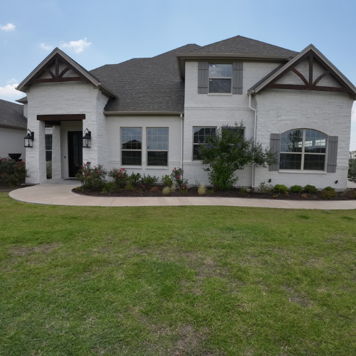 A large white house with a lot of windows