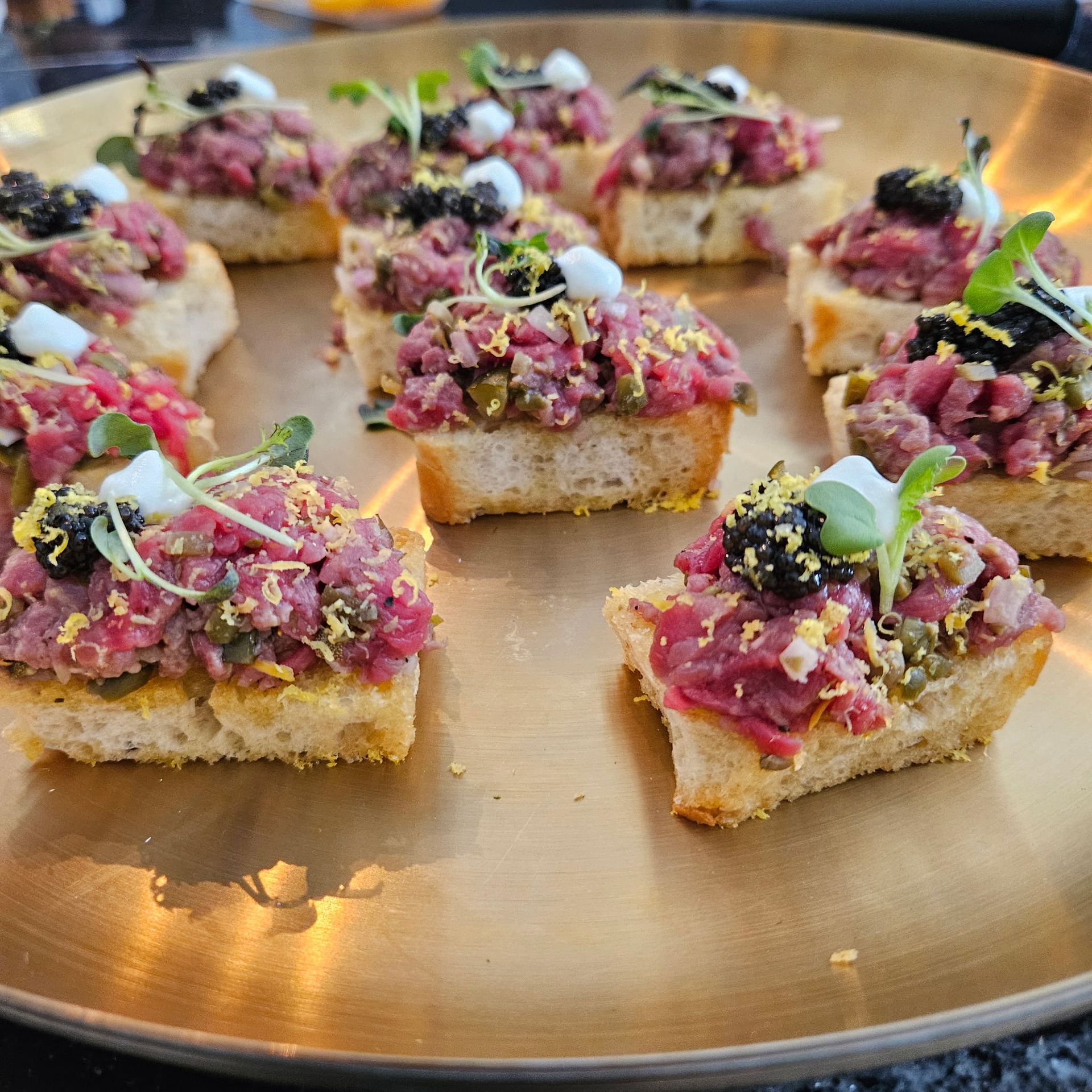 Bowl of Thai red curry with vegetables, garnished with basil and red chilies.