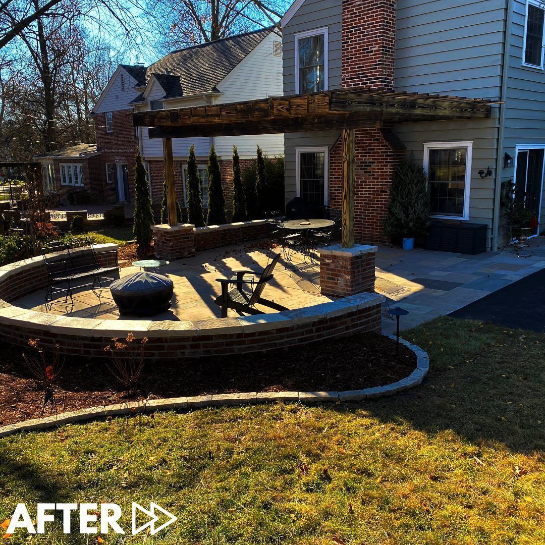 Backyard patio with a seating area around a fire pit, a pergola, and landscaping.