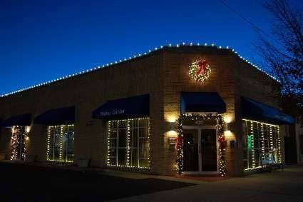 commercial building with holiday lights installed