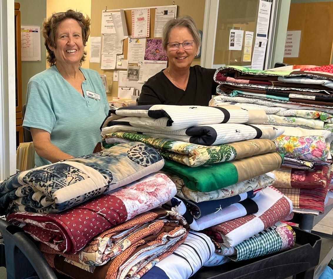 Faith Quilters Donate Handmade Quilts to The Homeless Coalition