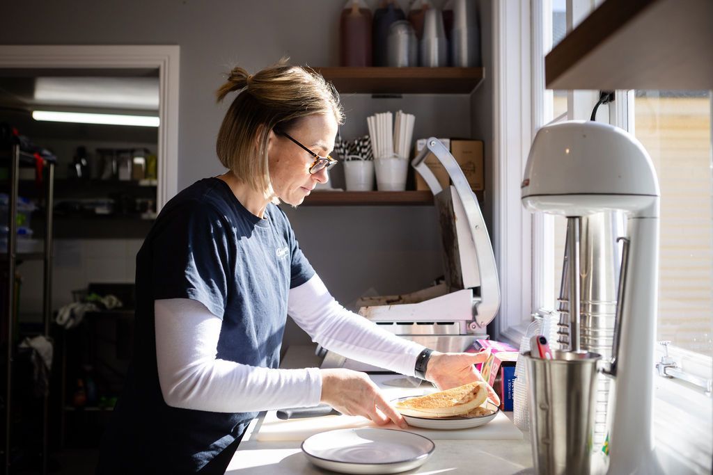 Woman preparing food in cafe