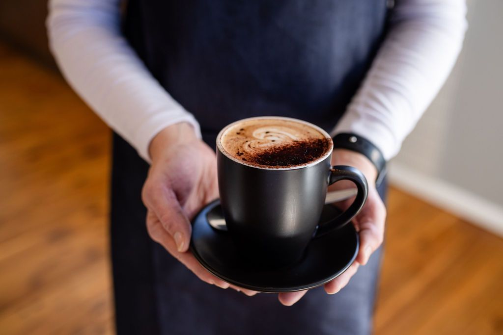 Serving coffee at Guardhouse Cafe