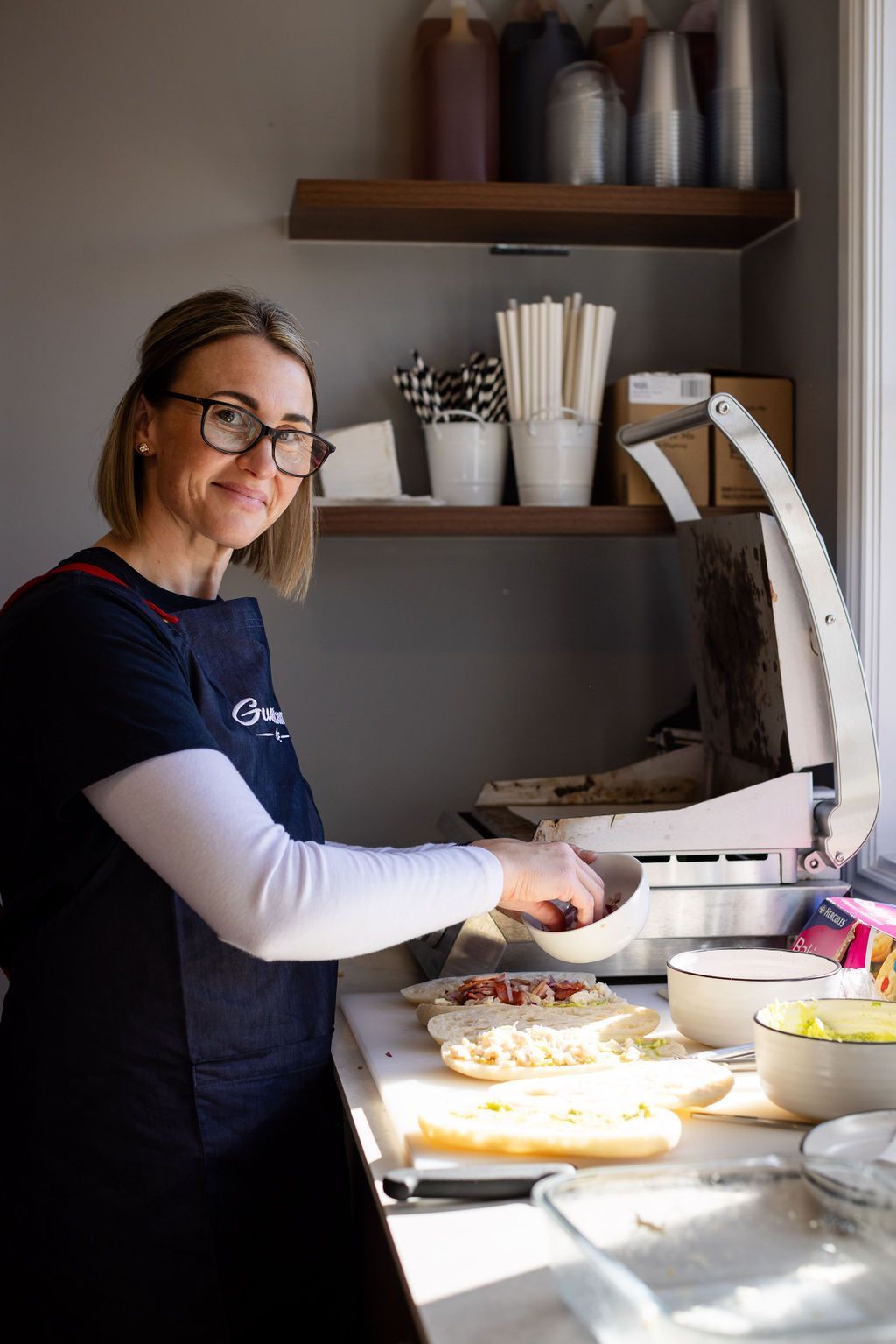 Woman preparing food in cafe