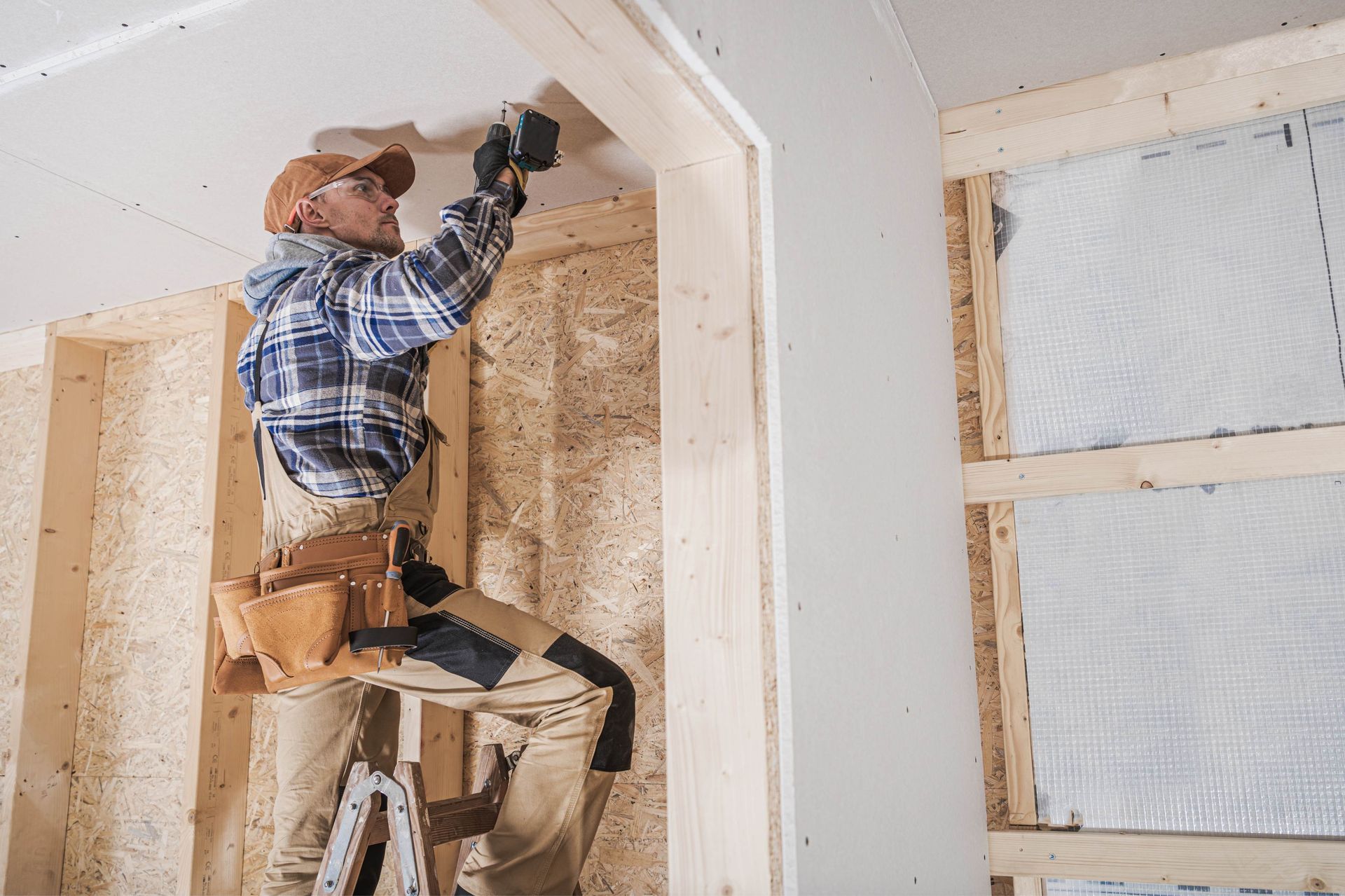 Man installing drywall