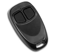 Black, oval-shaped key fob with two rectangular buttons and a small hole at the top.