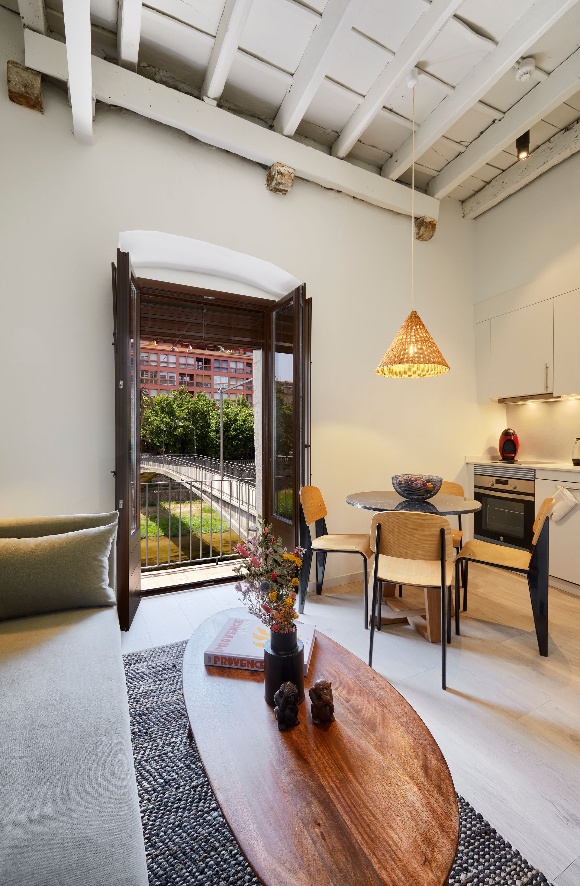 A living room with a couch a table and chairs