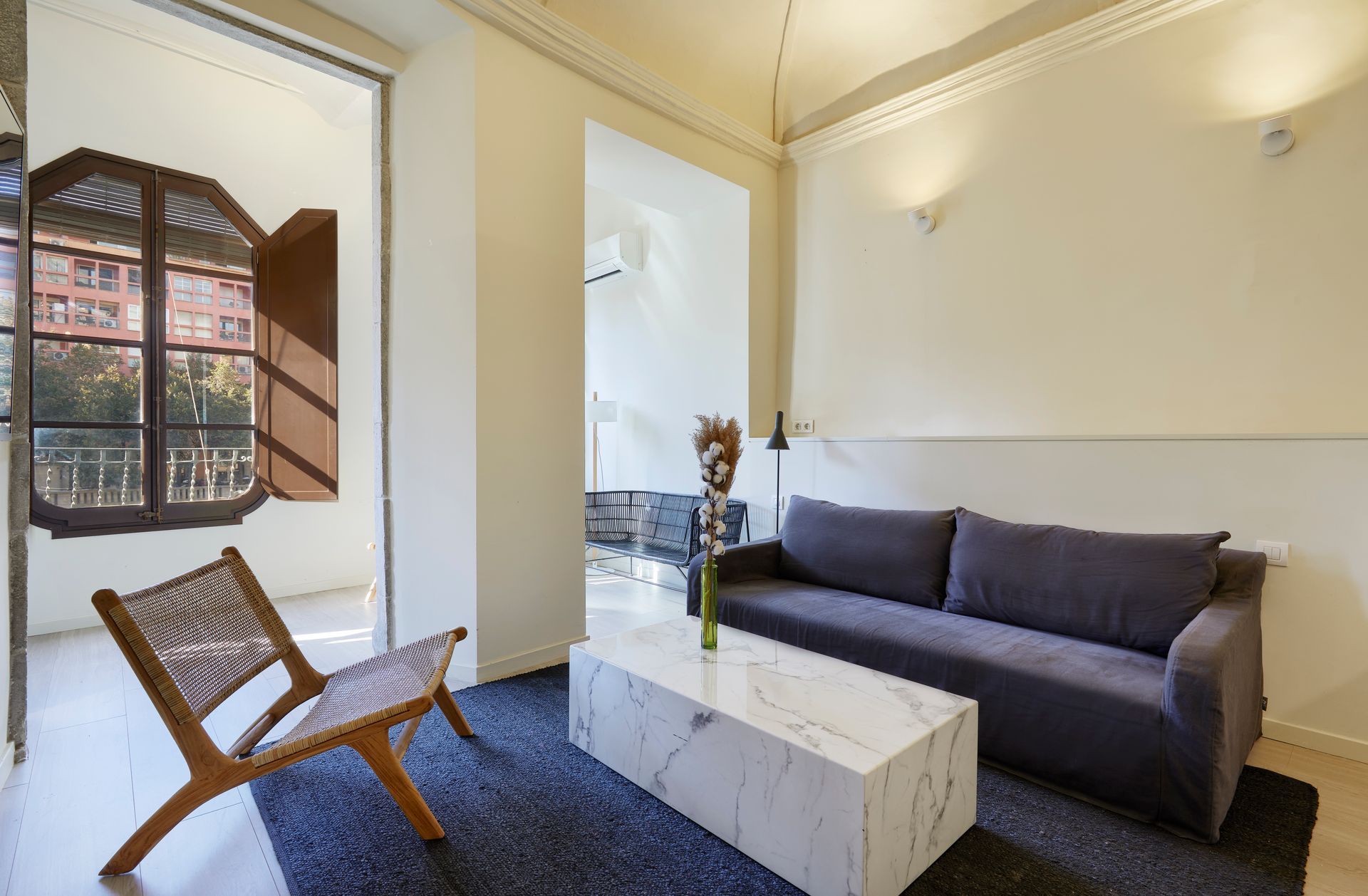 A living room with a couch and a coffee table