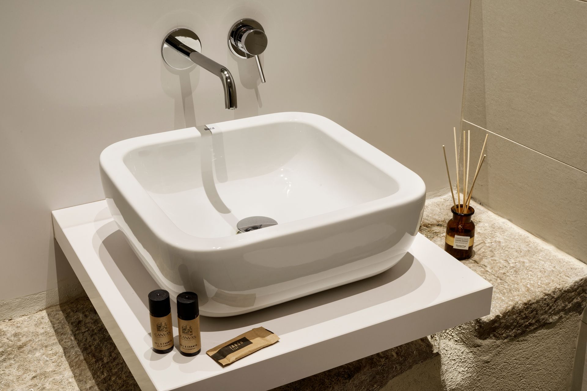 A bathroom sink is sitting on top of a counter.