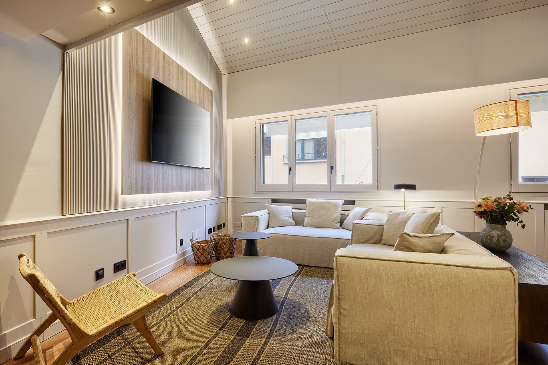 A living room with a couch , table , chair and television.
