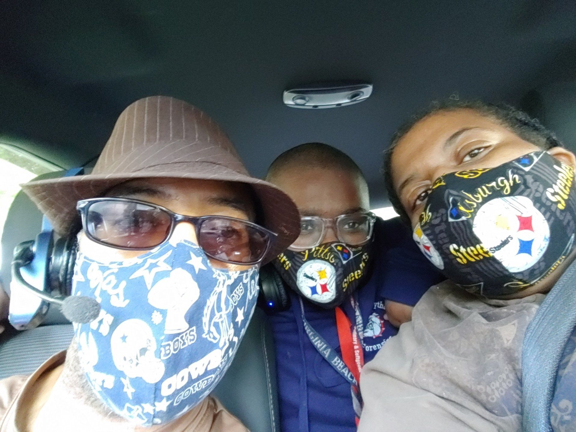 A group of people wearing face masks with the word steelers on them