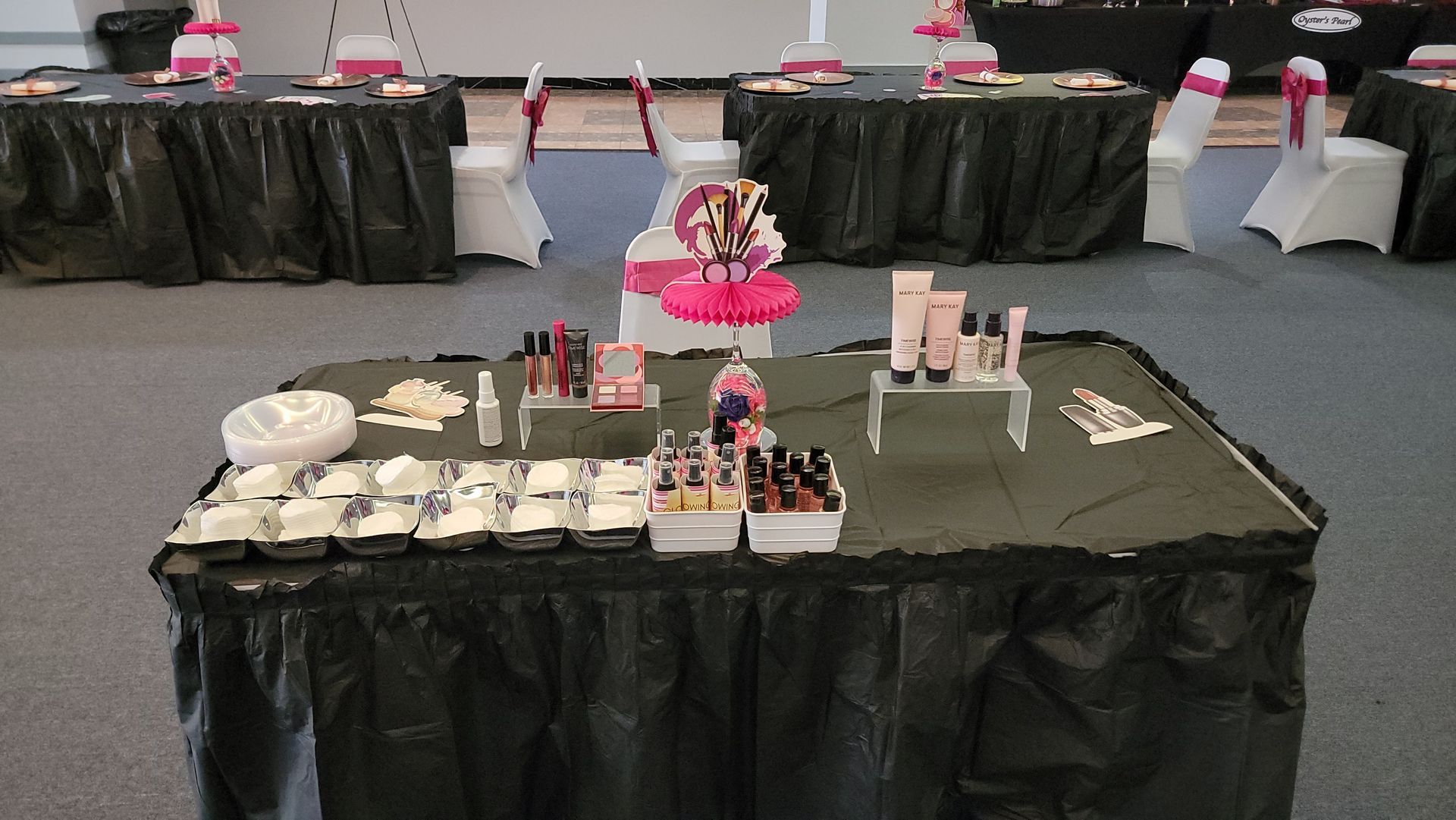 A table with a lot of cosmetics on it
