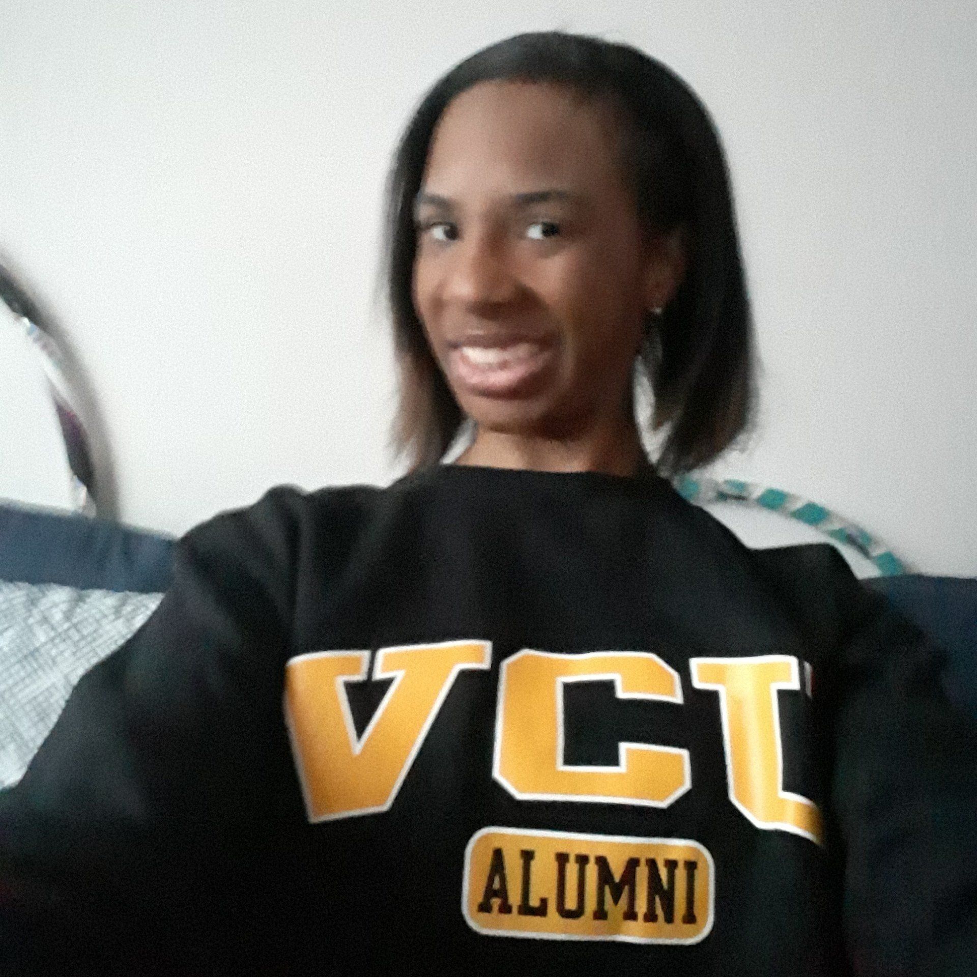 A woman wearing a black shirt that says vct alumni