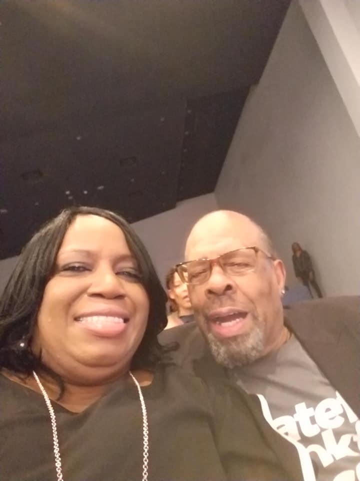 A man and a woman are posing for a picture together.