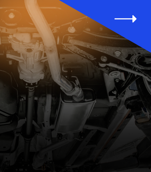 Underside of a car showing the exhaust system and suspension components.