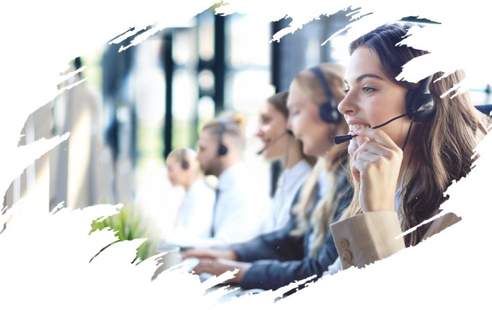 A group of people wearing headsets are sitting in a call center.