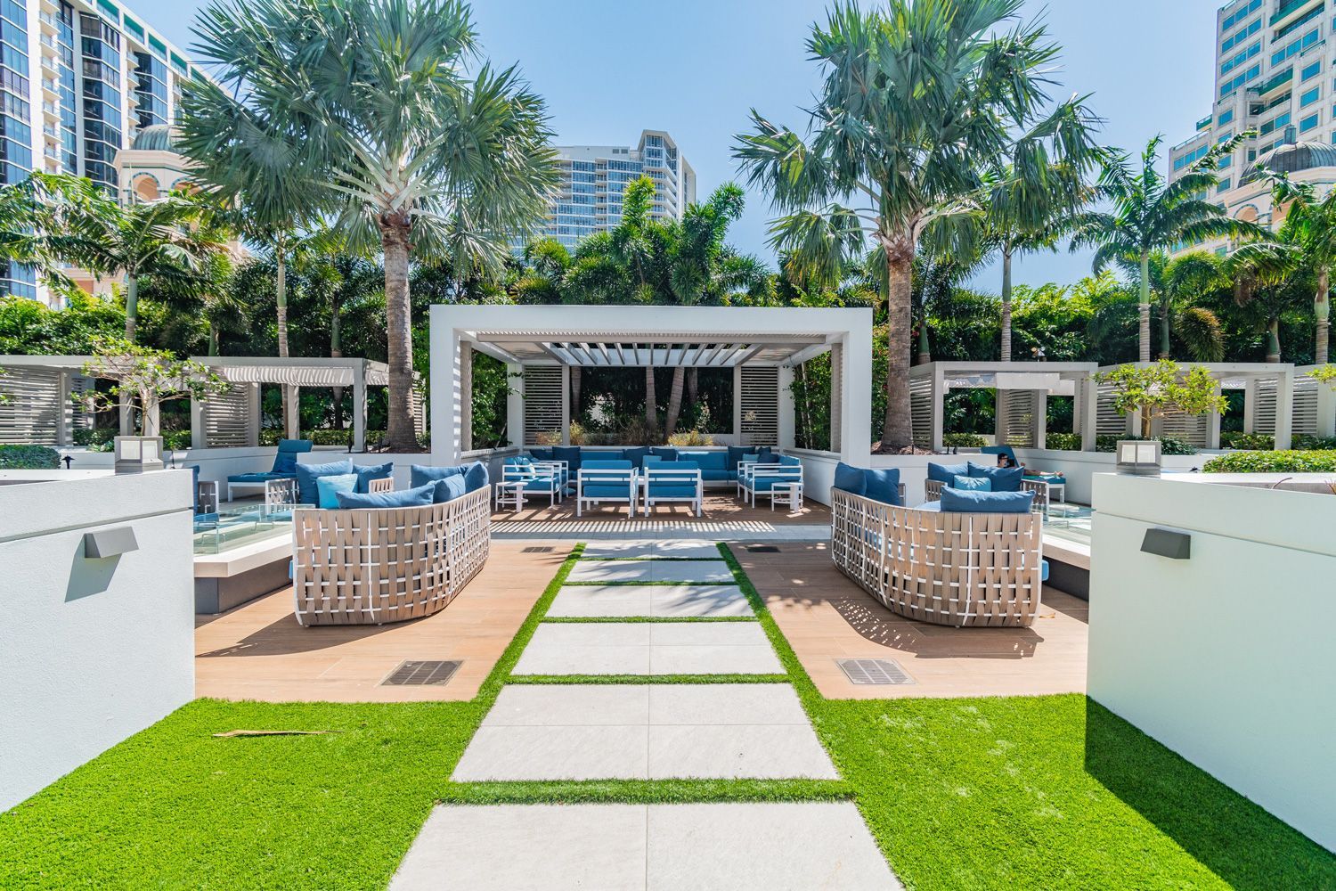 A patio area with a gazebo , couch , chairs , and palm trees backyard shoot in St. Petersburg by Craig Westerman