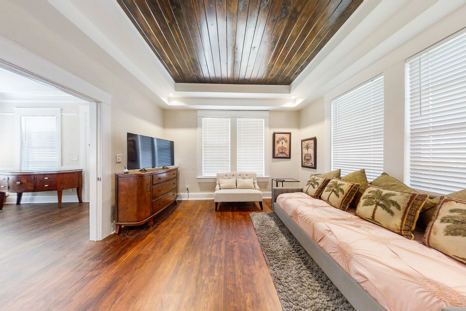 Beautiful back room with gorgeous wood tile and vaulted wood ceiling shot in St. Petersburg, Florida luxury home by Craig Westerman and his team.