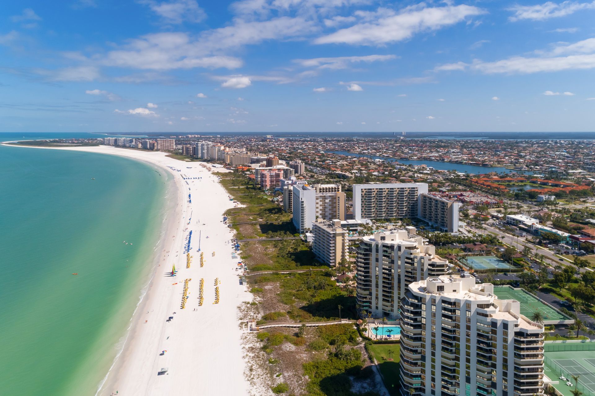 Marco Island Beach - Drone shot showing beach line and hotels