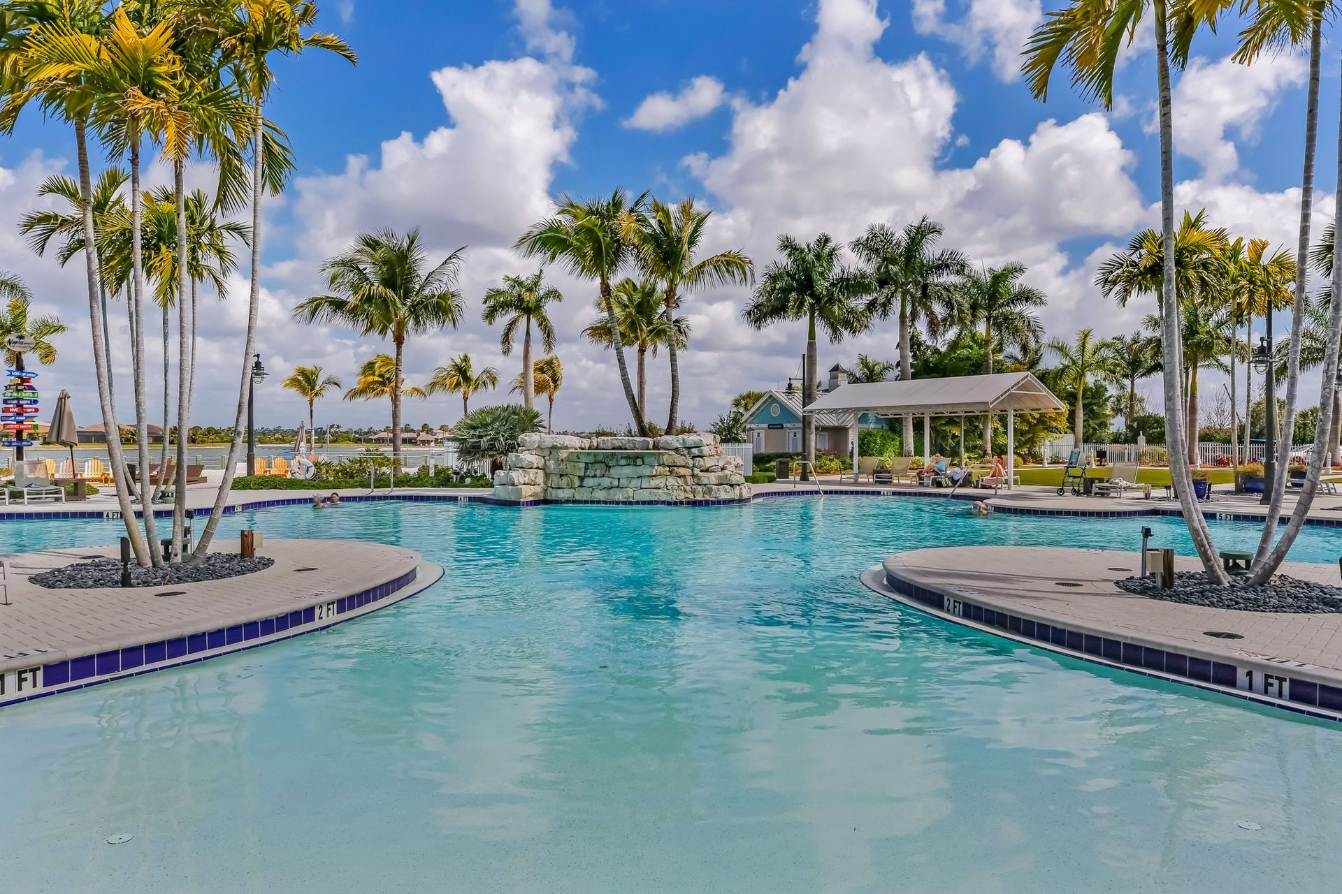 a large house with a large swimming pool in front of it by Craig Westerman