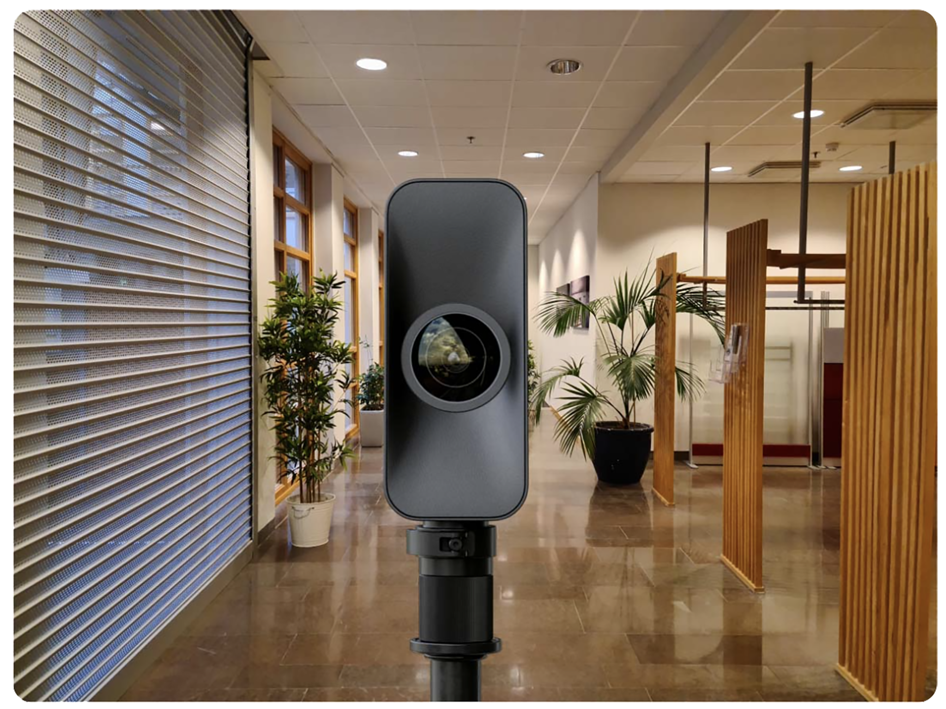 A matterport camera is sitting in the middle of a hallway getting ready for a Virtual Tour shoot. 