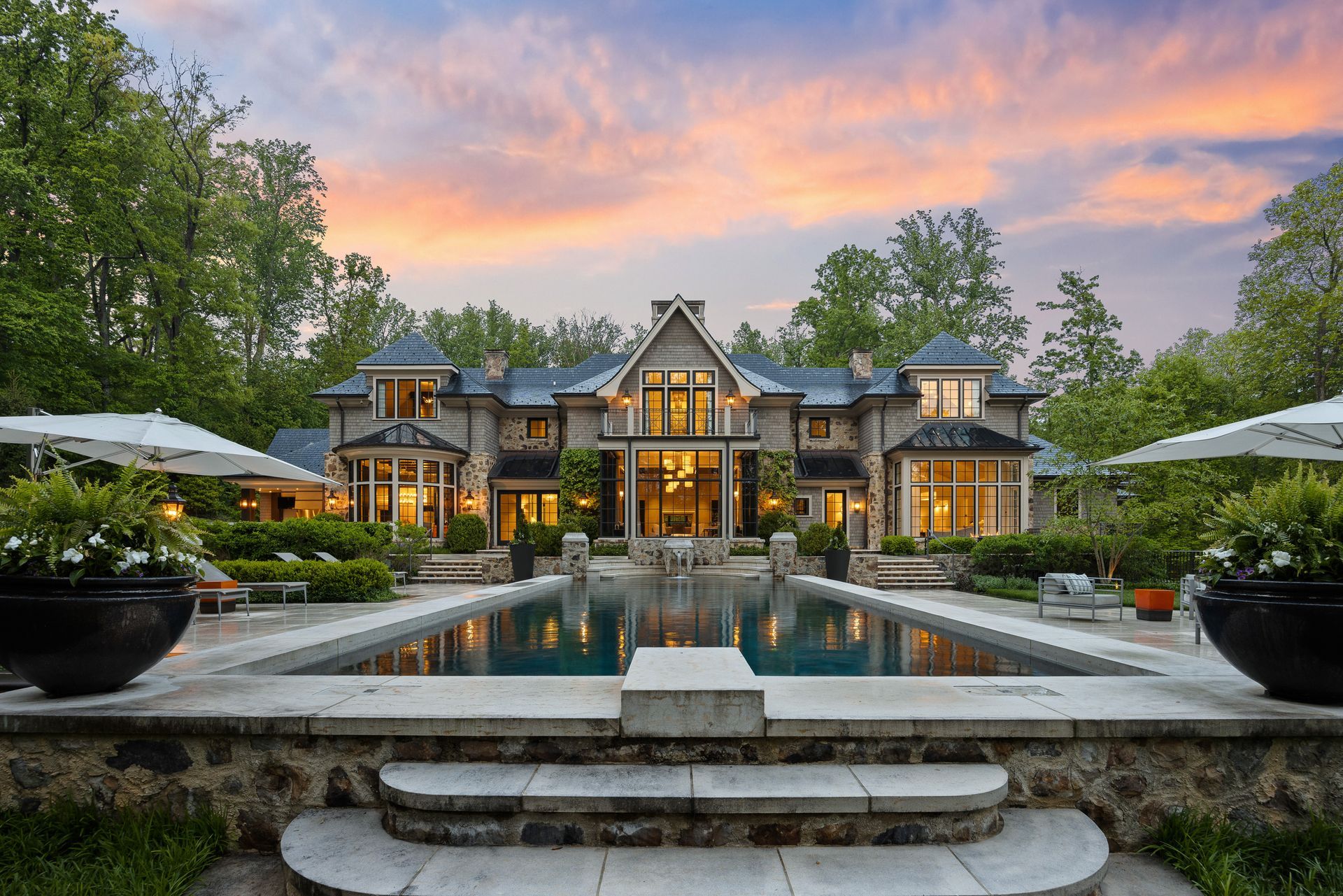 a large house with a large swimming pool in front of it. photo shoot by craig westerman