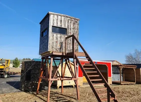A wooden tower with stairs leading up to it