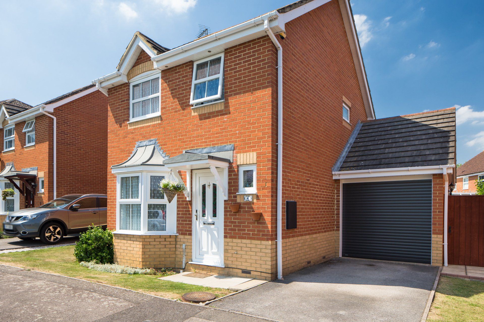 The front of a house showing a newly fitted garage door