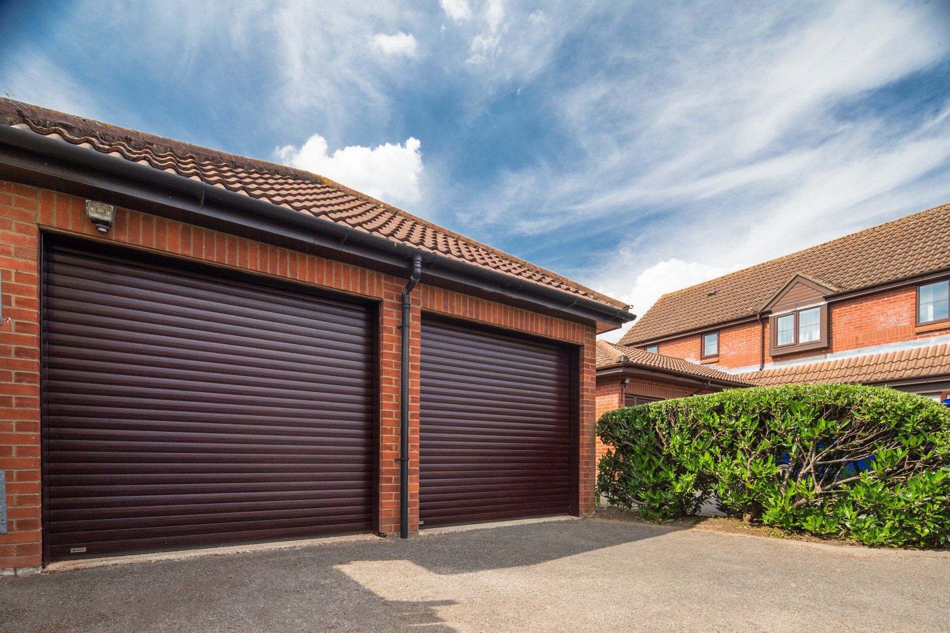 A double fronted garage with newly fitted garage doors