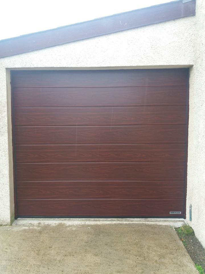 A newly fitted brown sectional garage door