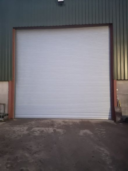 A large industrial garage door on a warehouse