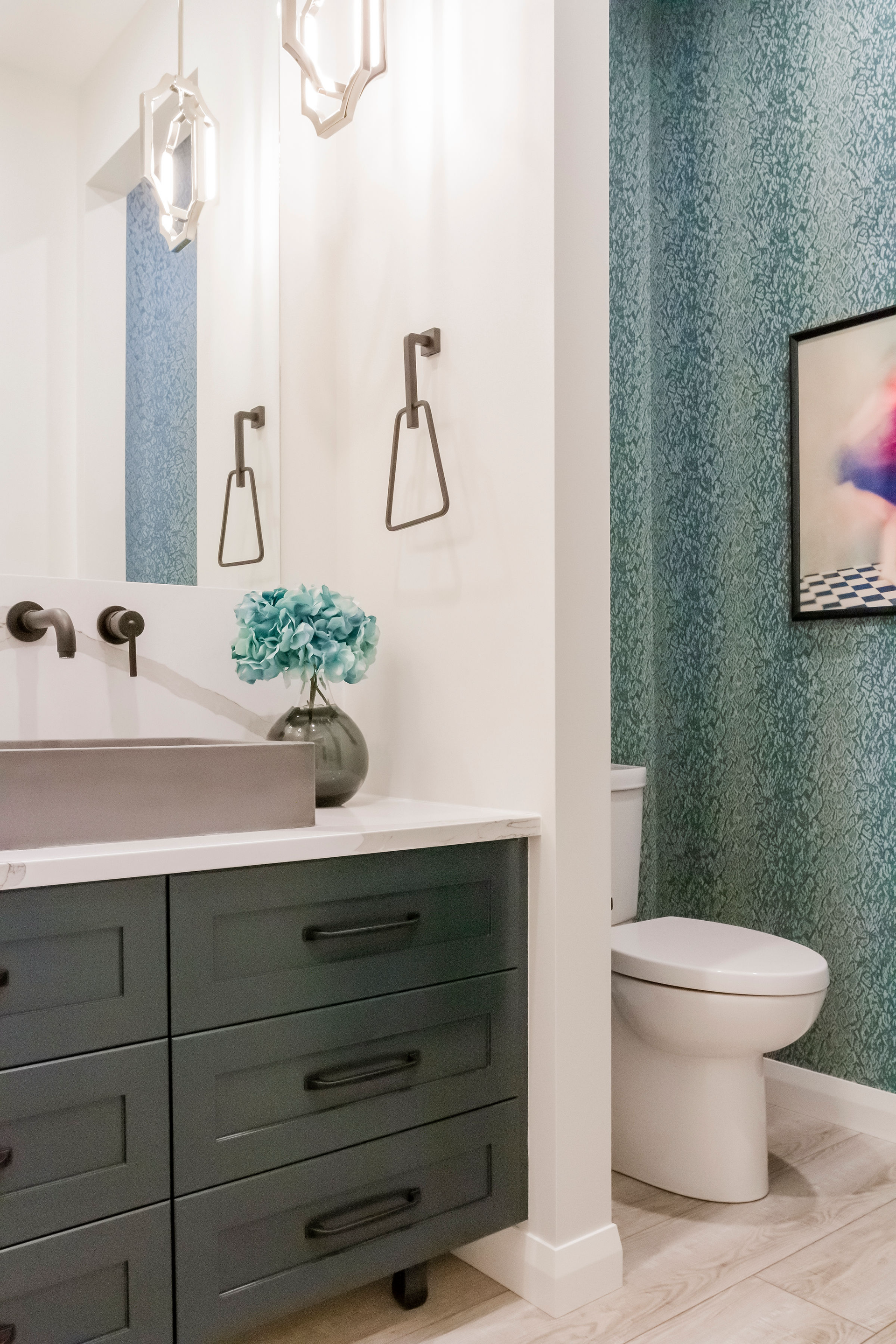 A bathroom with a sink , toilet and mirror.