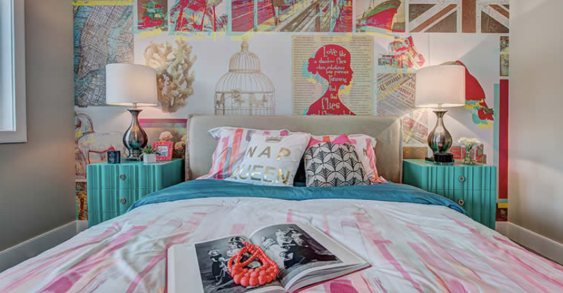 A bedroom with a bed , nightstands , lamps and a magazine on the bed.